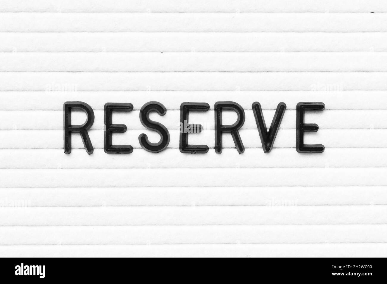 Black letter in word reserve on white felt board background Stock Photo