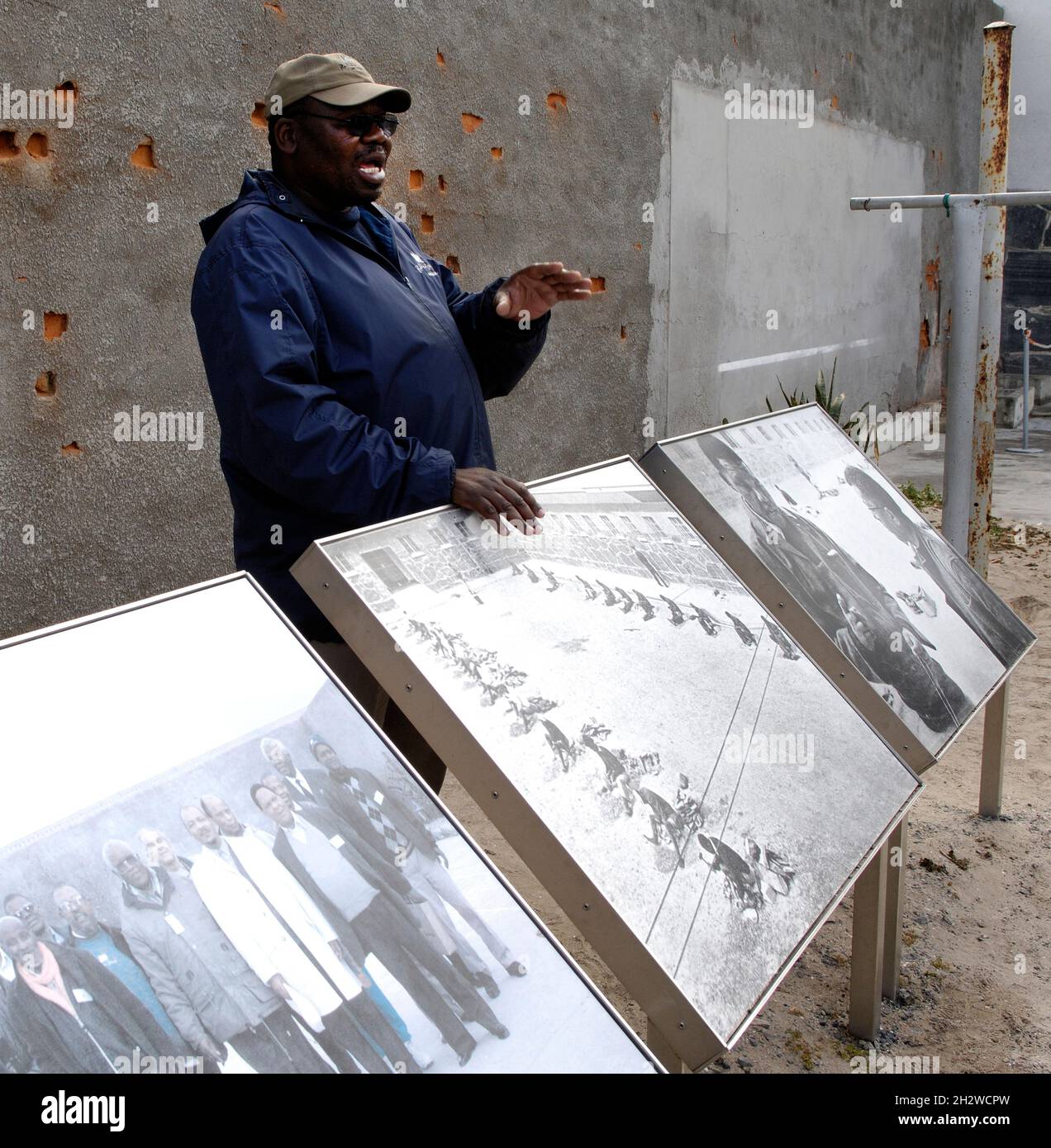 A former inmate now working as a tourist guide at The Prison on Robben Island, Cape Town, South Africa. Stock Photo