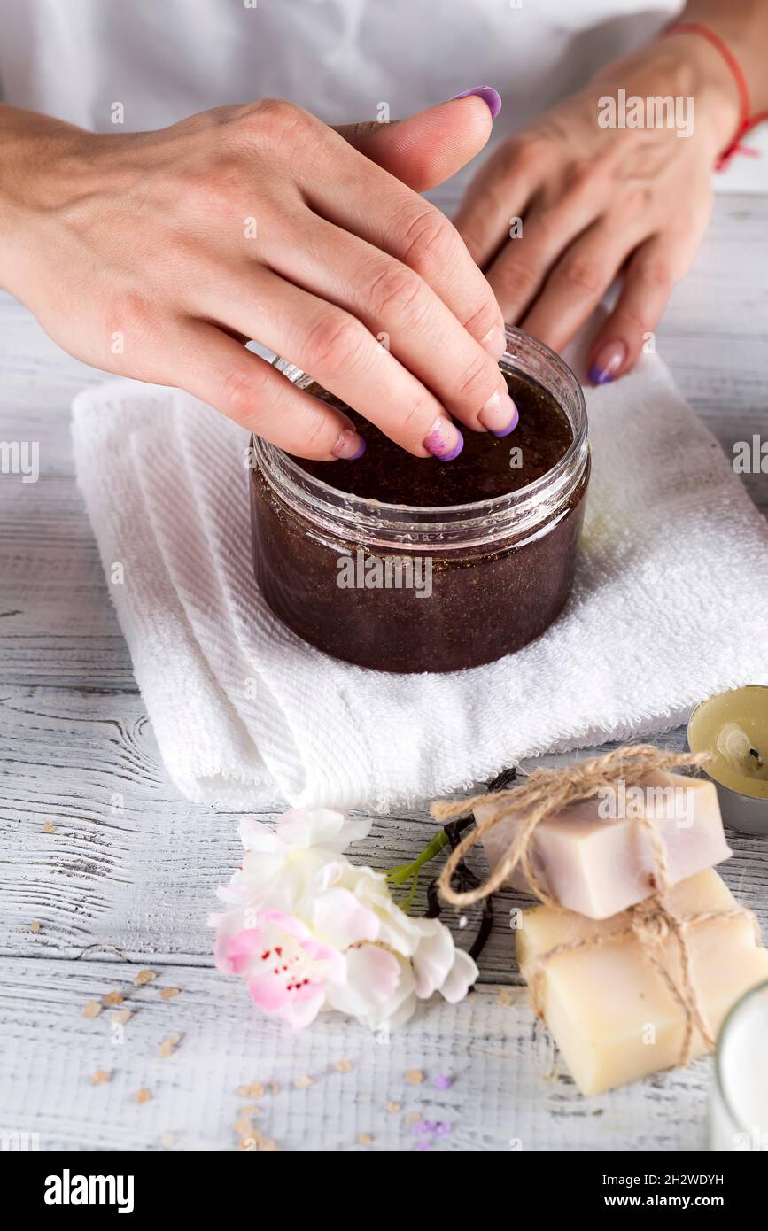 Woman hands receiving a hand scrub peeling Stock Photo Alamy