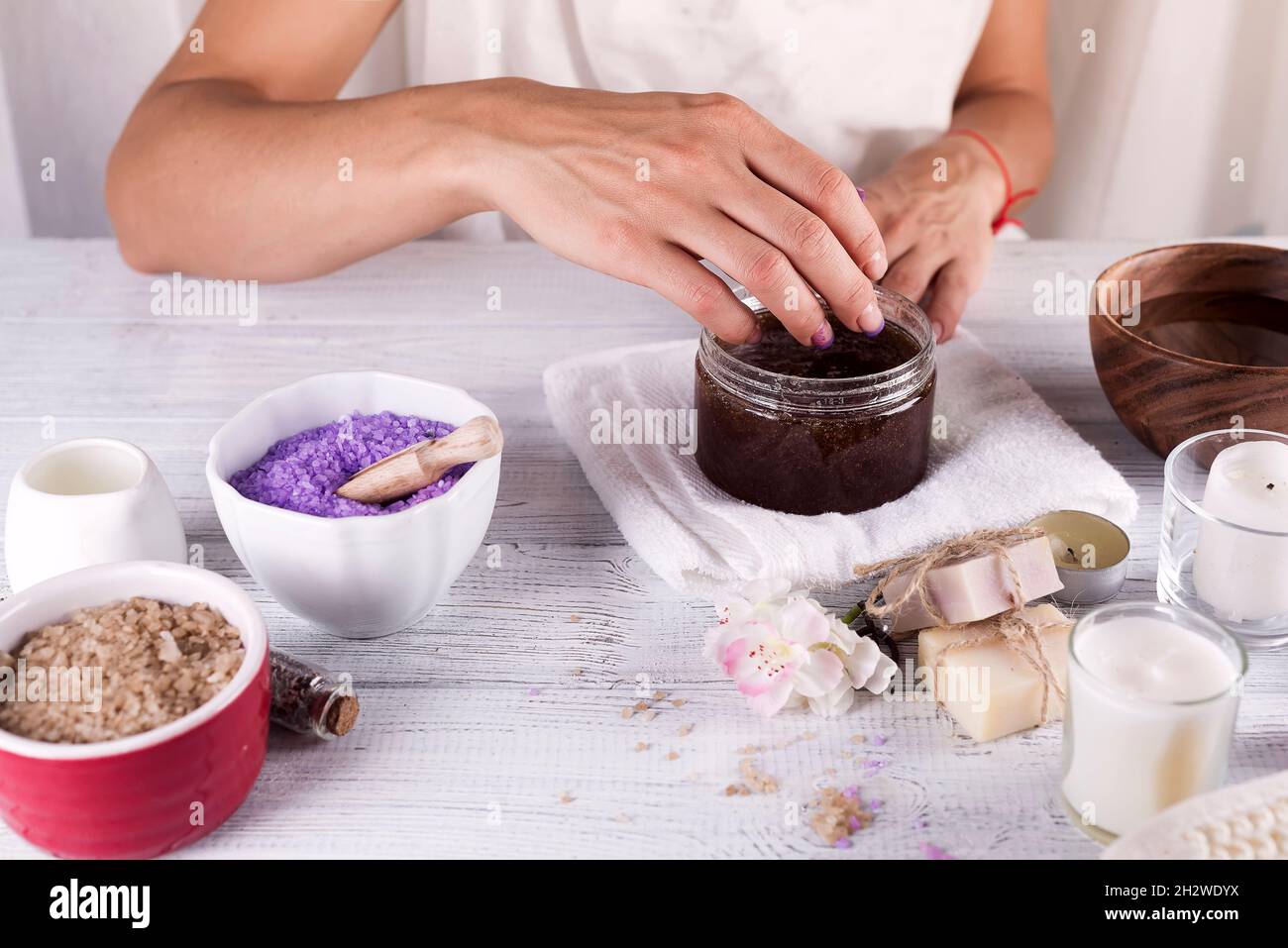 Woman hands receiving a hand scrub peeling Stock Photo Alamy
