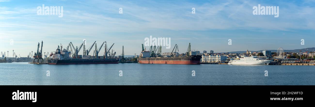 Varna, Bulgaria, October 22, 2021. Varna seaport panorama on a sunny autumn  day. Two large cargo ships and luxury charter yacht moored at the pier  Stock Photo - Alamy