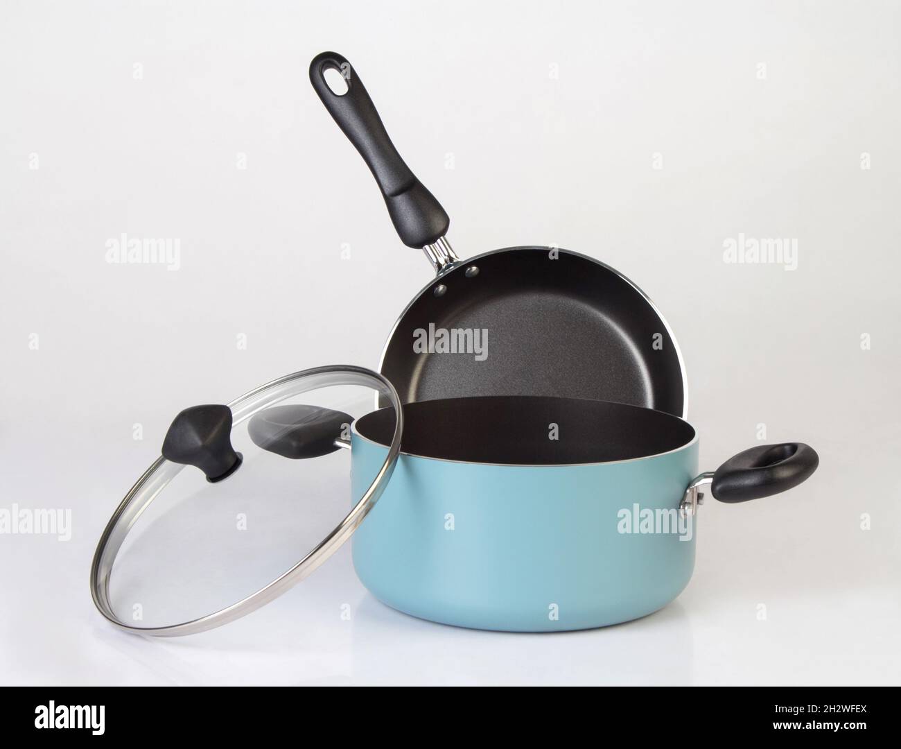 Set of non-stick pot and frying pan isolated on white background Stock Photo