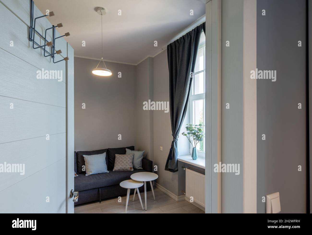 Contemporary interior of modern apartment. Door to living room with