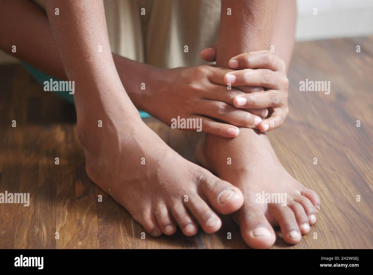child boy suffering pain on feet Stock Photo Alamy
