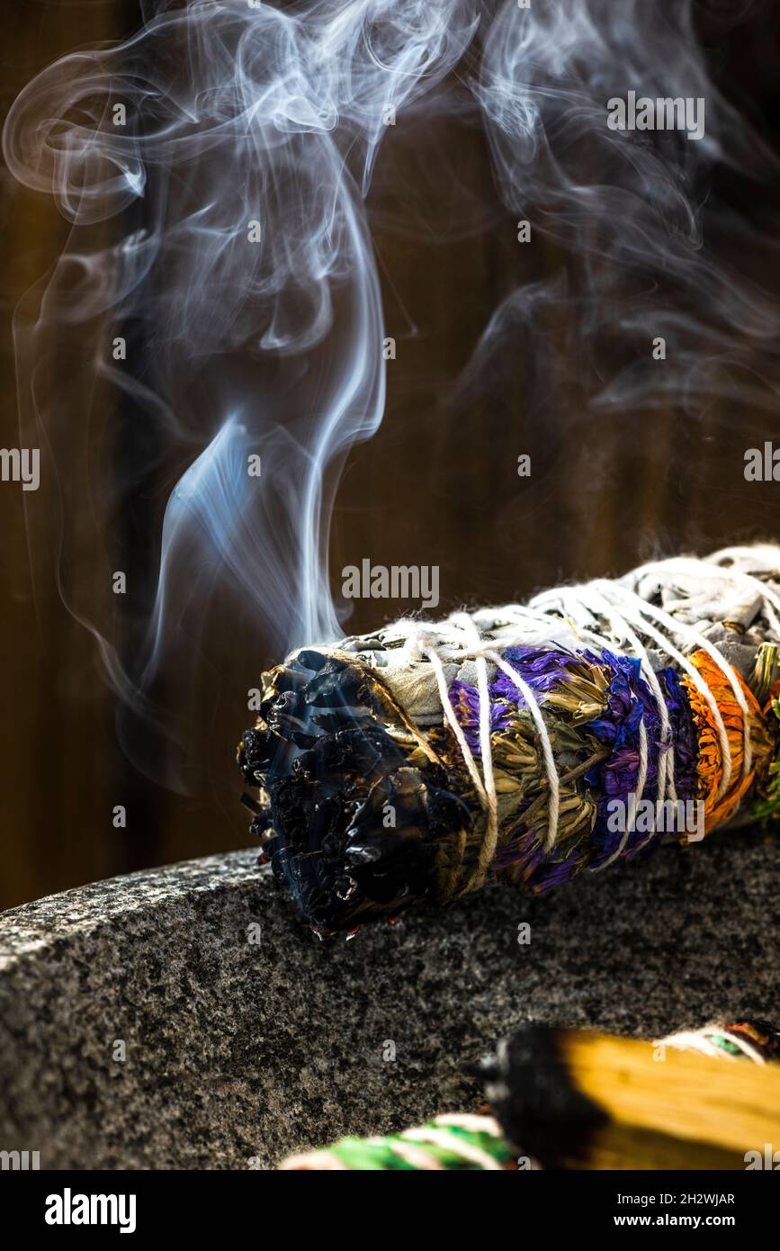 burning tobacco spiritual Smudge Ritual Burning Sage Stick. Spiritual Meditation and Yoga Ritual  Stock Photo