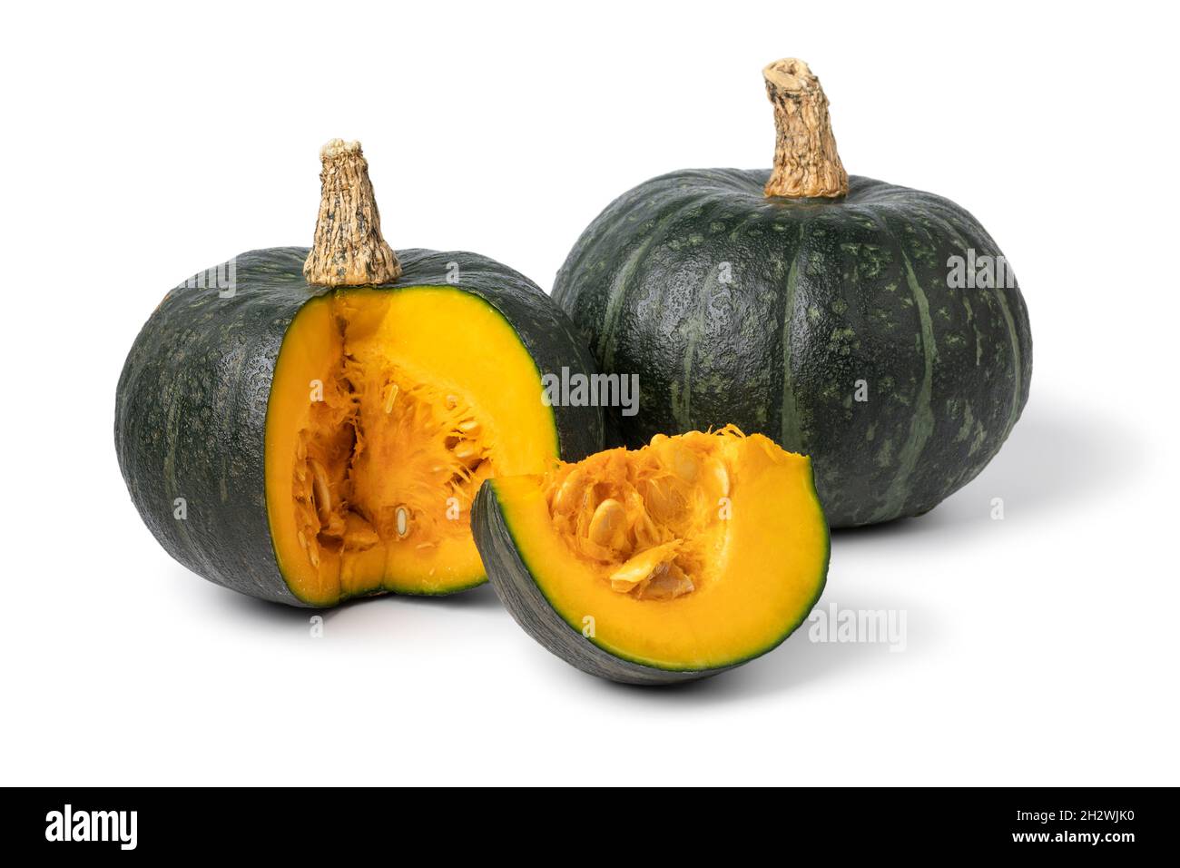 Fresh green whole Kabocha pumpkin and a cut close up isolated on white background Stock Photo