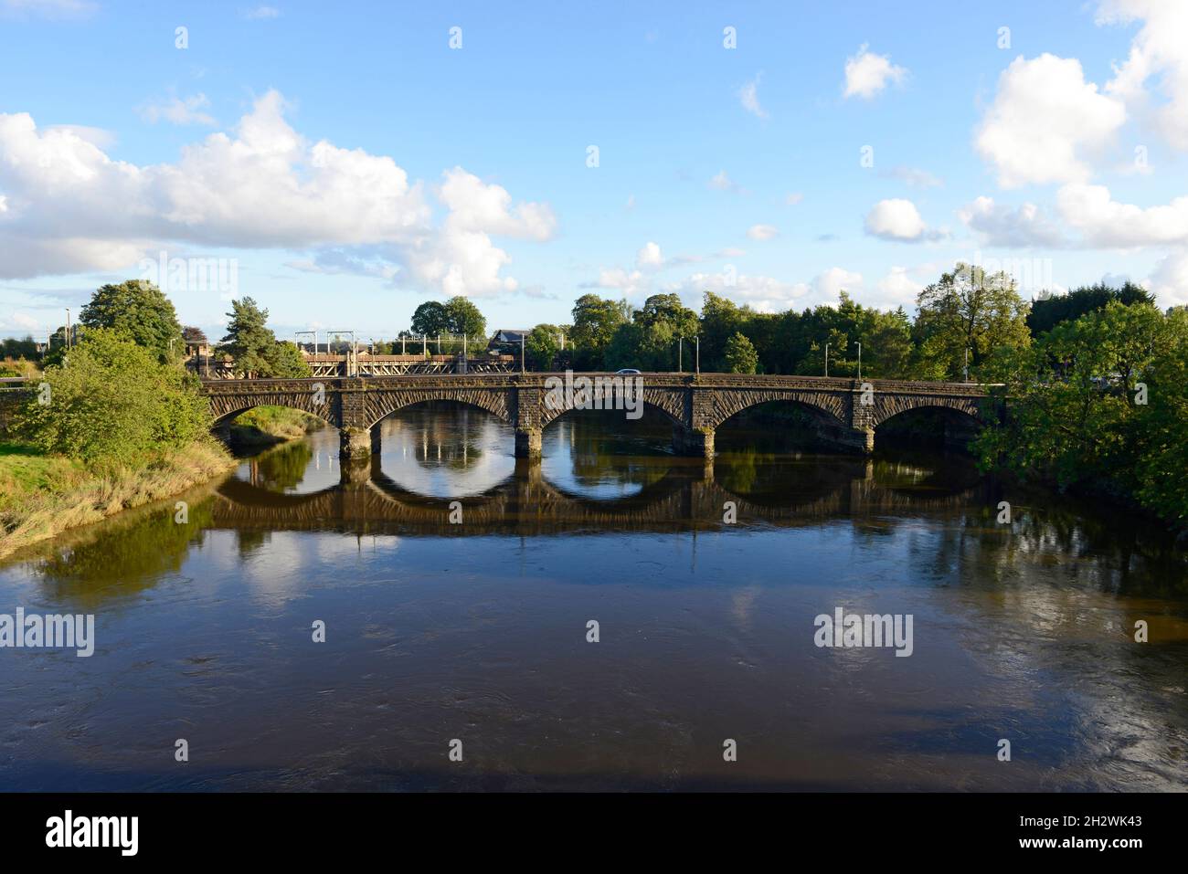 View of Stirling Bridge carrying road traffic across the river Forth, with the railway bridge behind. Stirling, Scotland. Stock Photo
