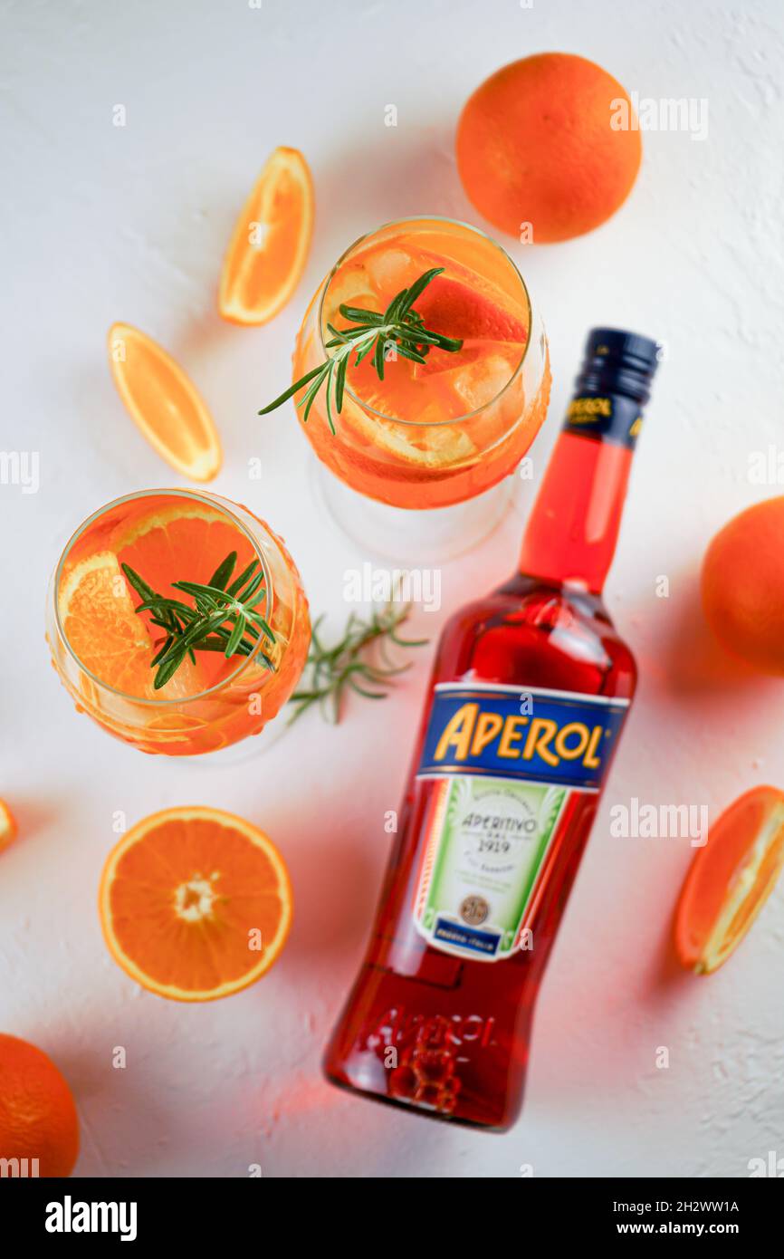 Aktuator køleskab slim Italian tincture Aperol for making cocktail Aperol Spitz. Red-orange wine  in a bottle. Alcoholic drink.