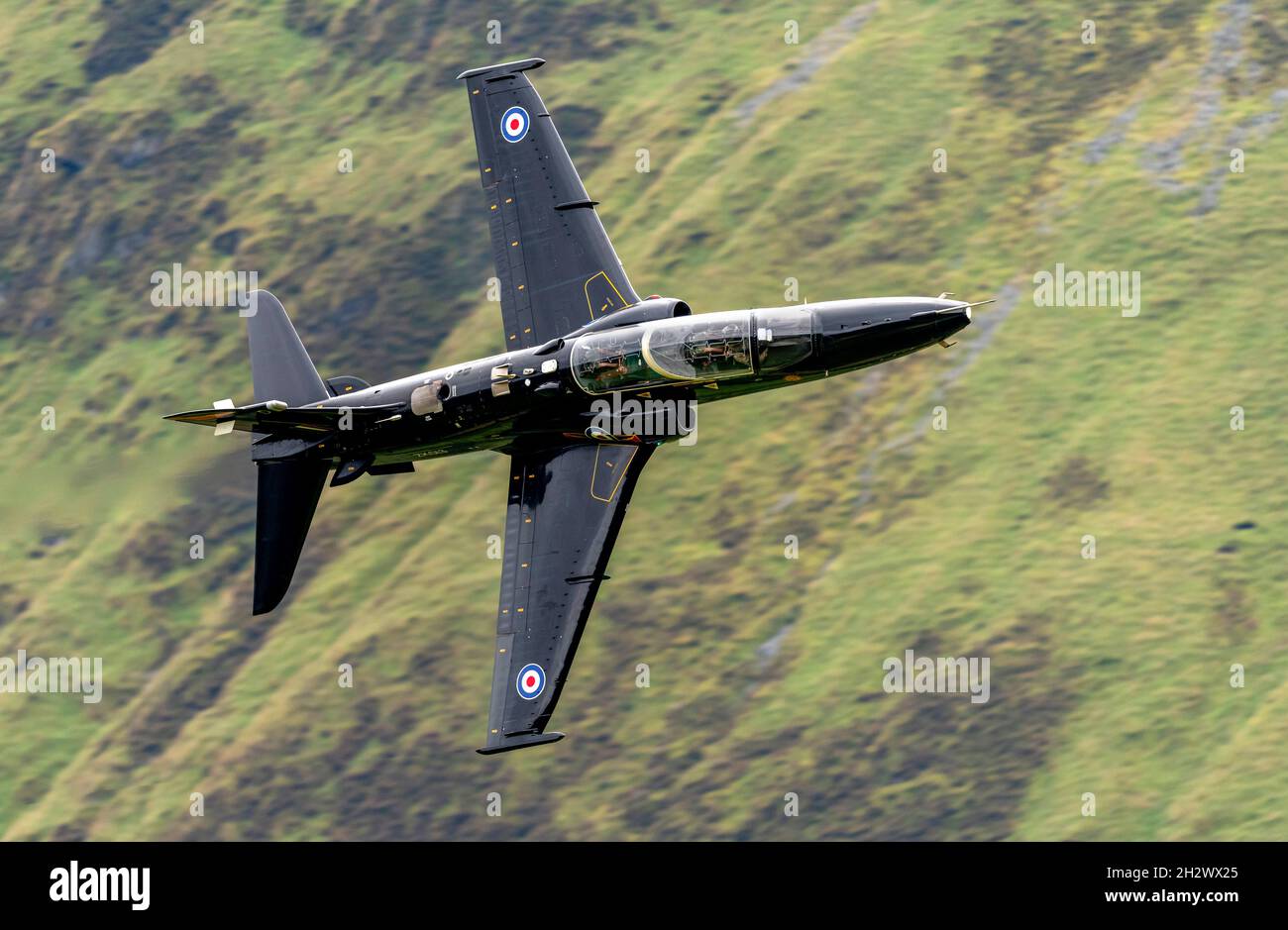 RAF Hawk T2 flying  low level in the Mach Loop, LFA7 Stock Photo