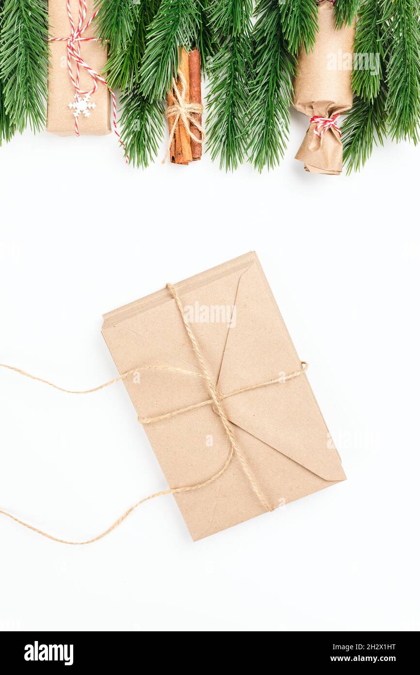 Christmas card, stack of craft envelopes tie jute rope with letters to Santa Claus and New Year decorations Stock Photo