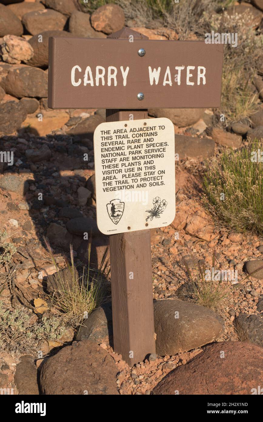 A National Park Service Warning Sign about Carrying Water in the Desert, Capitol Reef National Park - Torrey, Utah Stock Photo
