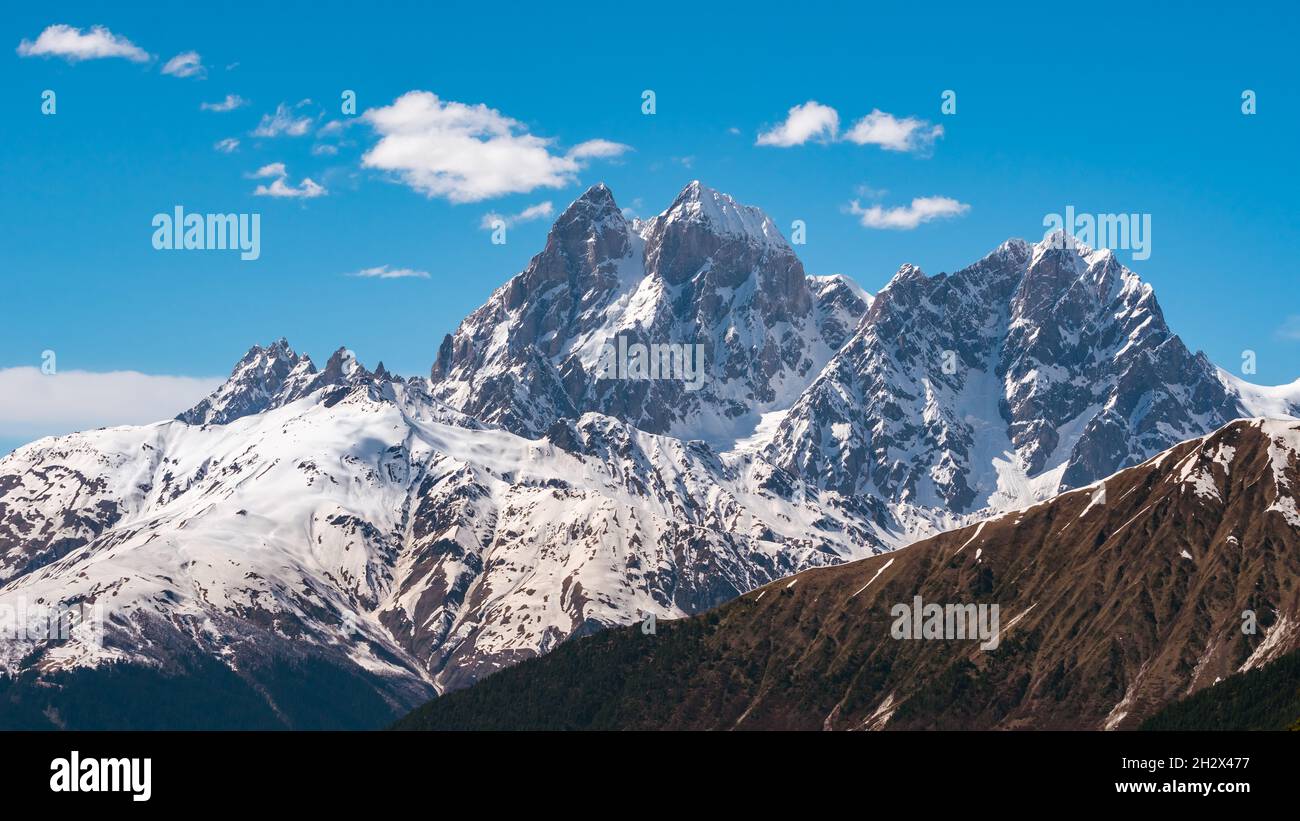 View of Mount Ushba. Ushba is one of the most notable peaks of the Caucasus  range, located in the Svaneti region of Georgia. Travel Stock Photo - Alamy, image size:1300x821