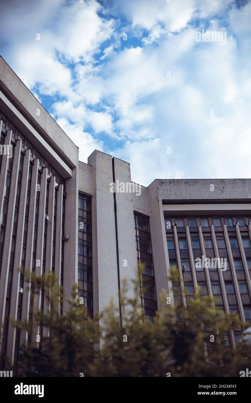 A vertical shot of a modern stone building with rows of windows Stock ...