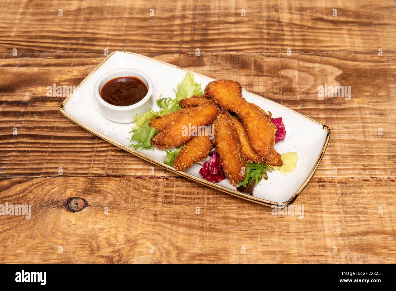 crispy chicken strips coated in wheat flour, panko and egg fried in