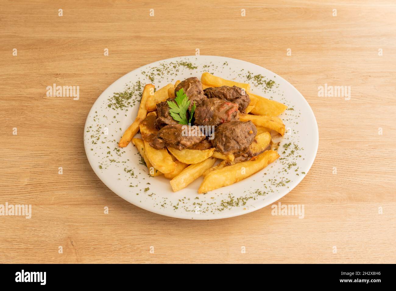 typical Spanish recipe for beef cheek stew with homemade chips Stock