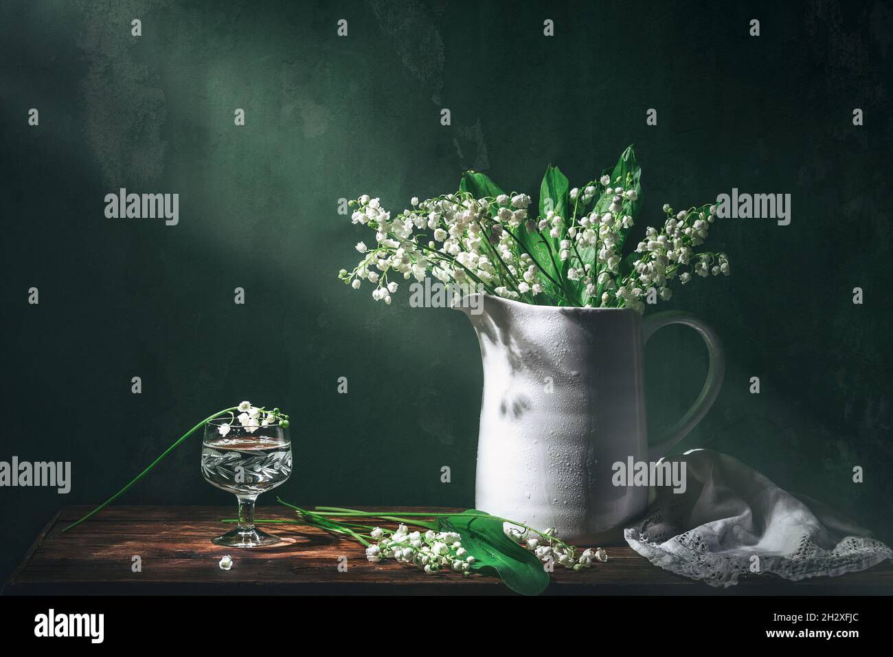 Classic still life with beautiful white Lily of the valley bouquet in ...
