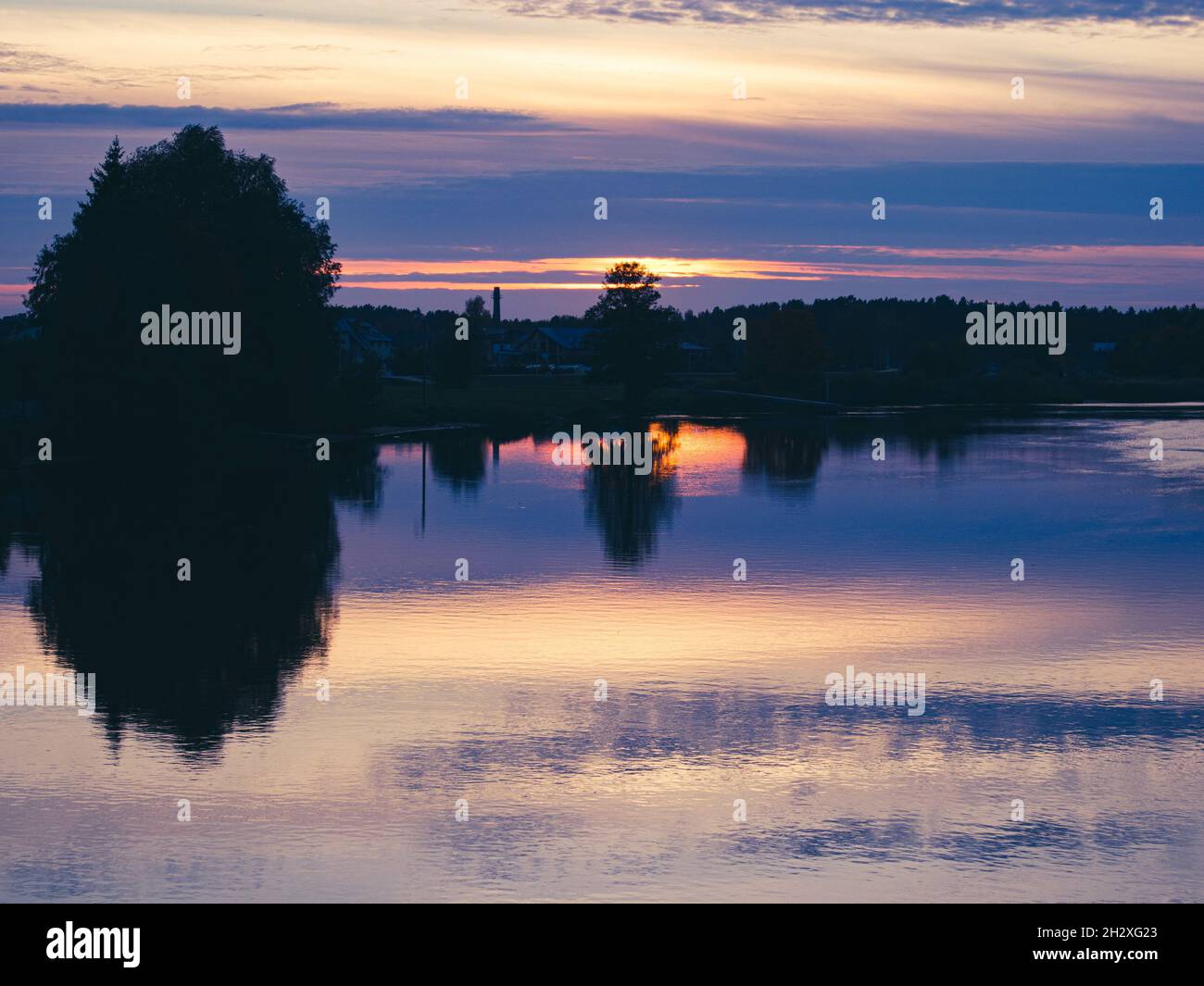 Sunset over trees and lake hi-res stock photography and images - Alamy