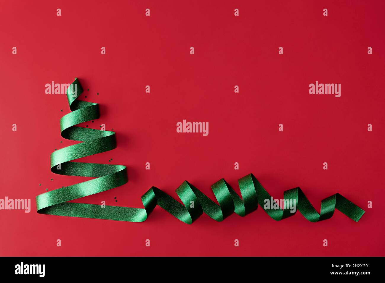 Christmas tree made of green ribbon on a red background, Christmas ...