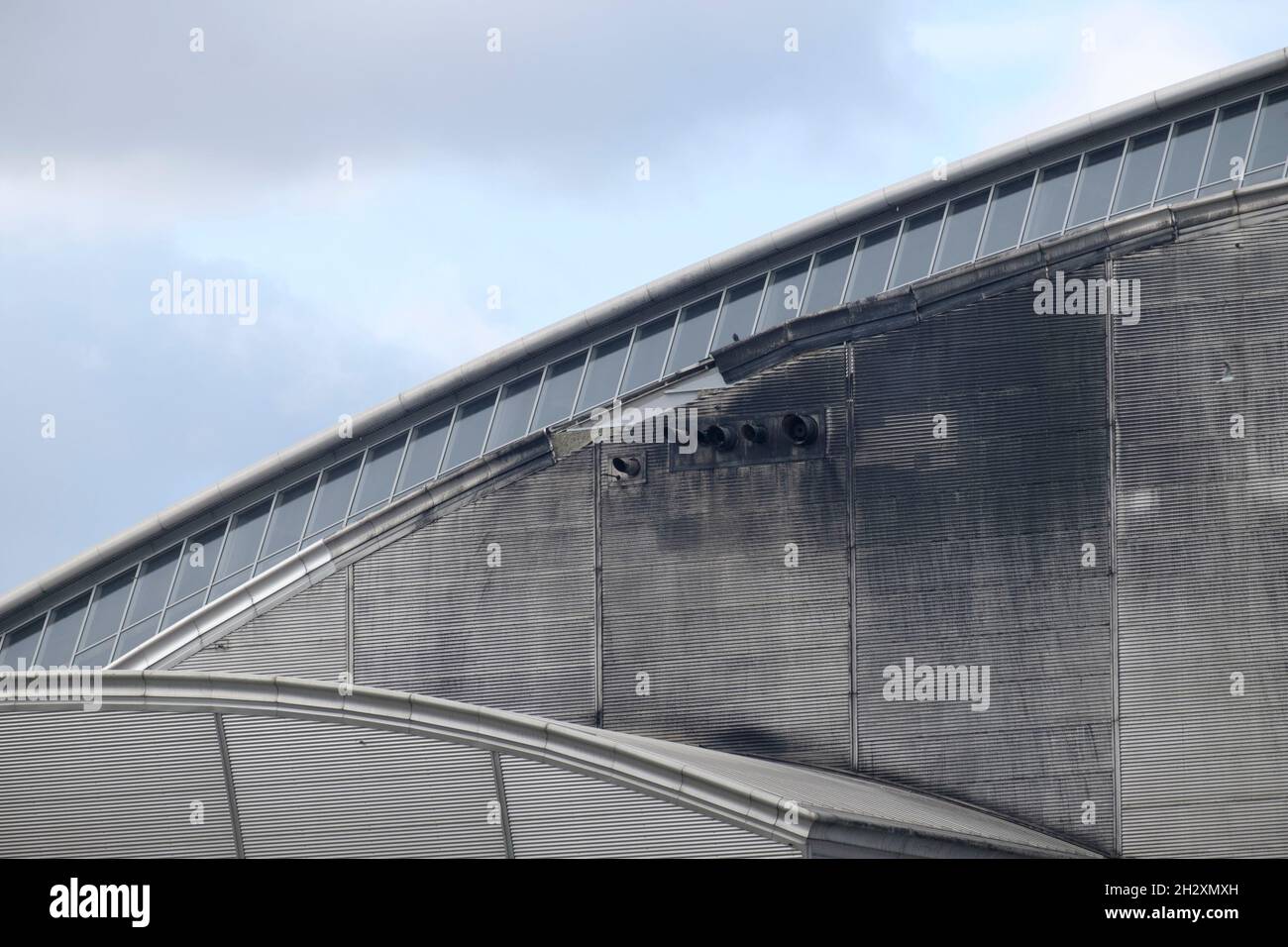 Damage to exterior of Crossness sewage treatment works sludge incinerator. Stock Photo