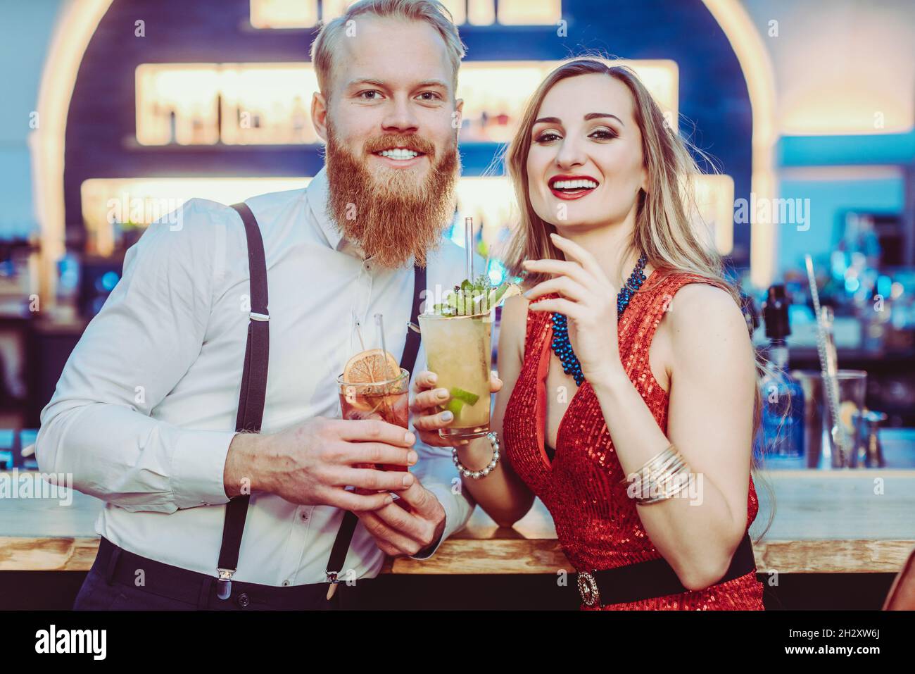 Portrait of young couple enjoying the cocktail drink Stock Photo