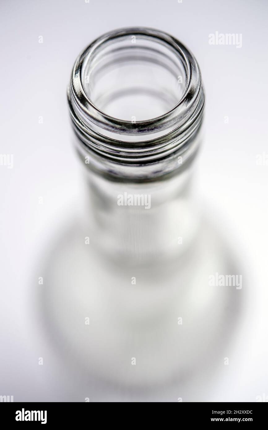 Detail of the open top of a clear glass bottle Stock Photo