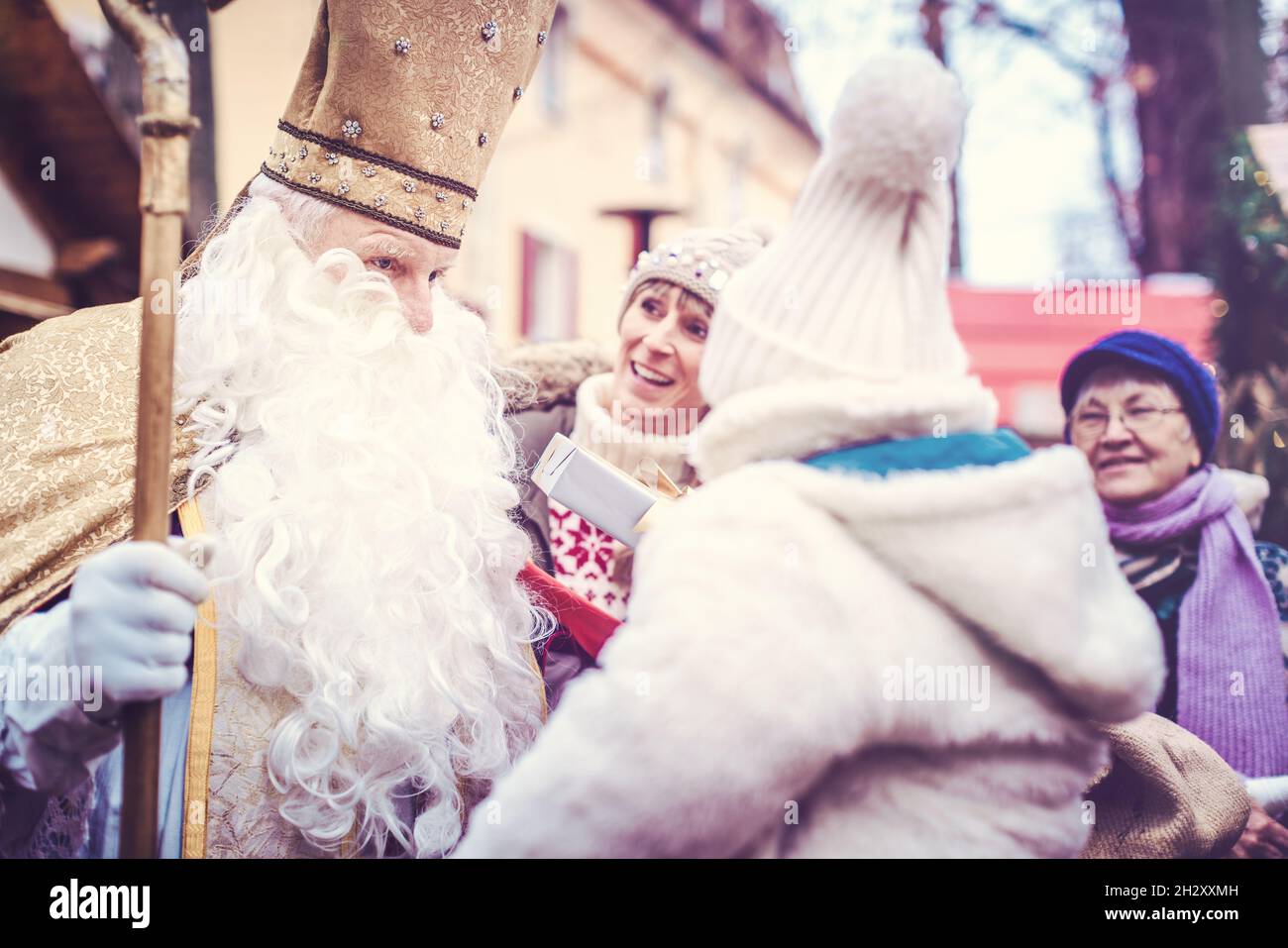 St Nikolaus and an extended family on the Christmas market Stock Photo