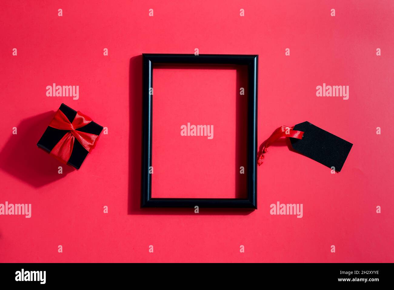 Black decorative photo frame with present box and label Stock Photo Alamy