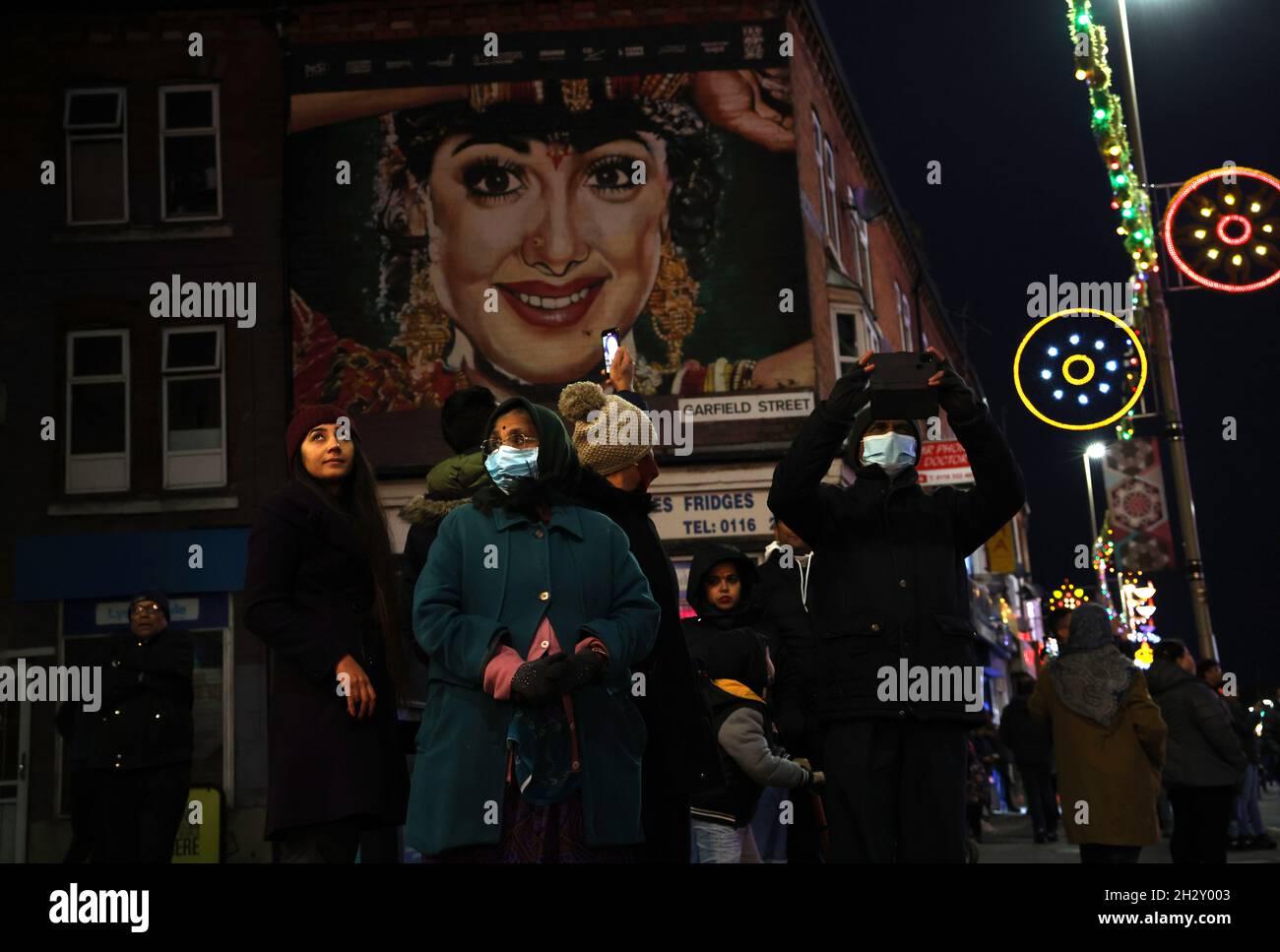 Leicester, Leicestershire, UK. 24th October 2021. People look at the Diwali lights on the Golden Mile after a switch on event different from normal with no main stage or firework display because of Covid-19 worries. Credit Darren Staples/Alamy Live News. Stock Photo