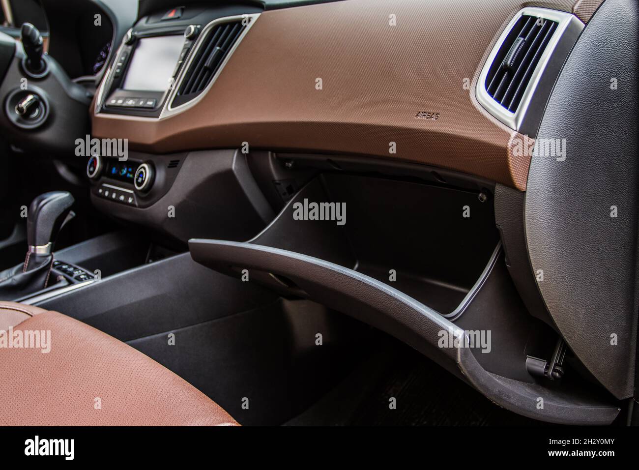 Opened car glove box compartment. Glove compartment of car Stock Photo