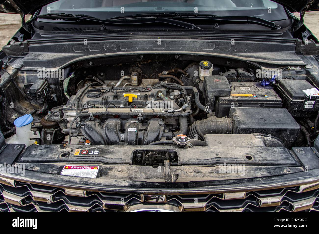 SUV car with open hood. Car engine. Car engine and parts under hood