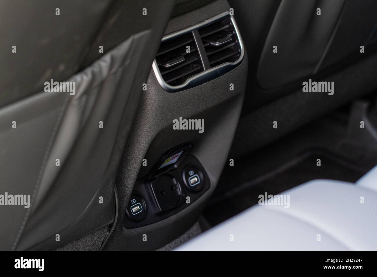12V and 220v power outlet socket in the car. Opened sockets Stock