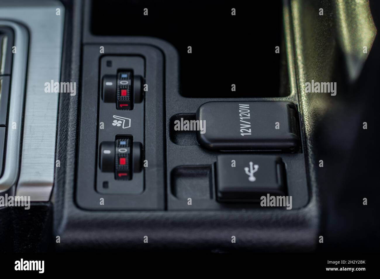 Seat heating controller buttons close up view. Car interior. Seat