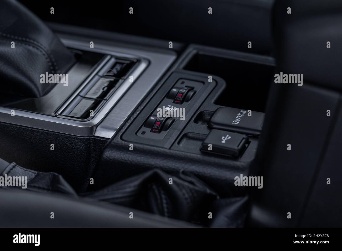 Seat heating controller buttons close up view. Car interior. Seat heater button, car interior