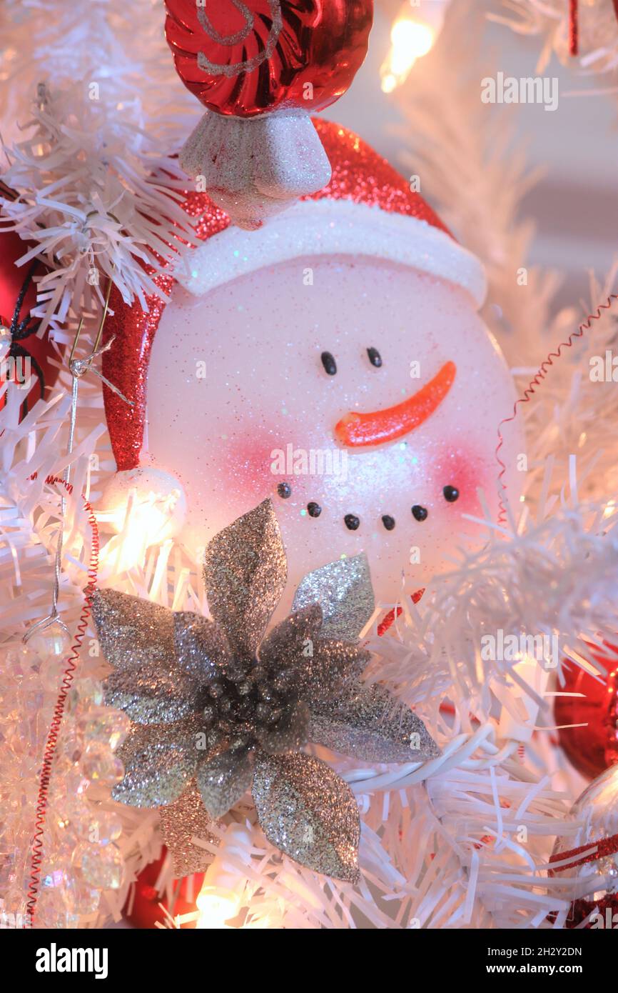 Christmas ornaments on a white Christmas tree Stock Photo