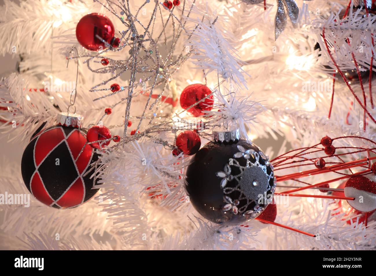 Christmas ornaments on a white Christmas tree Stock Photo