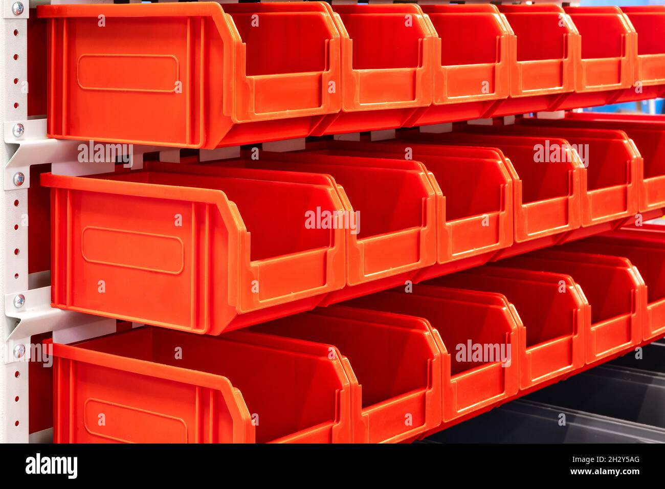 rows of multicolored plastic boxes for components Stock Photo