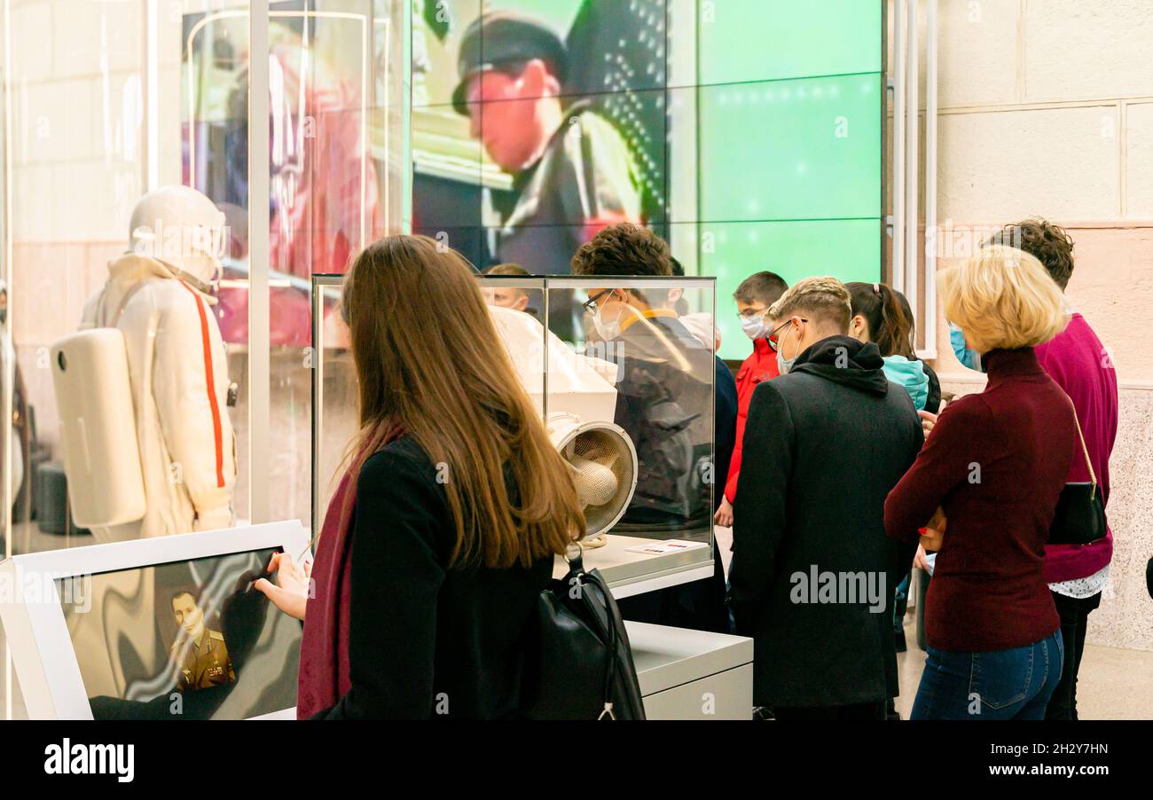 Visitors at the guided tour interact with exponats in The Cosmonautics and Aviation Centre. Pavilion No. 34 Space. VDNKH, Moscow, Russia Stock Photo