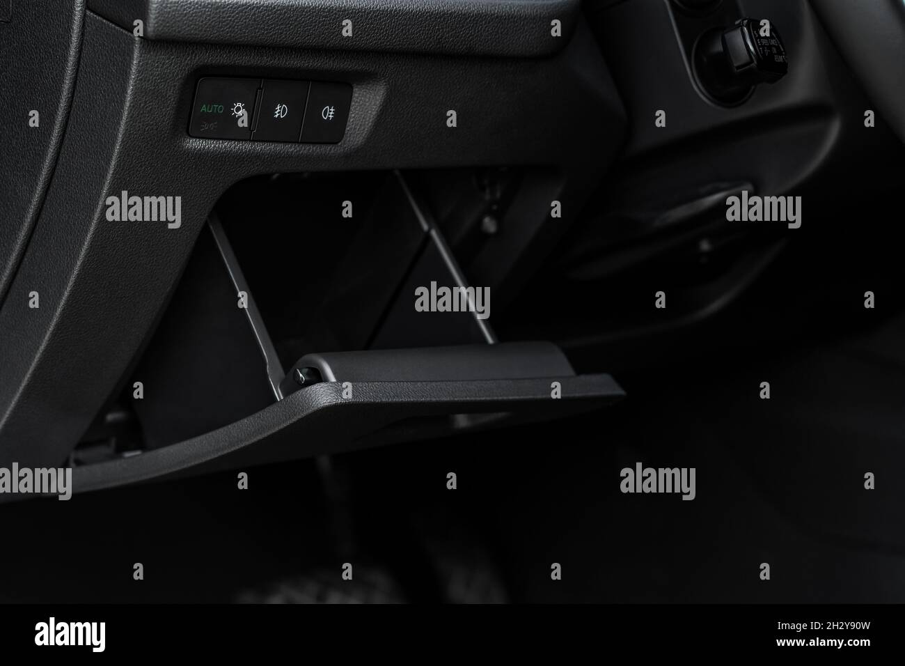 Opened car glove box compartment. Glove compartment of car Stock Photo