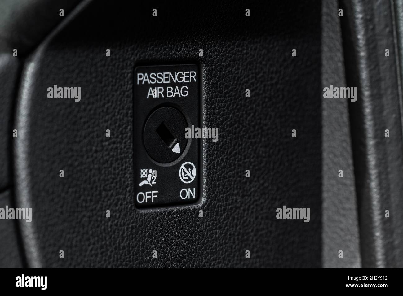 Front passenger airbag on and off switch close up view. Passenger
