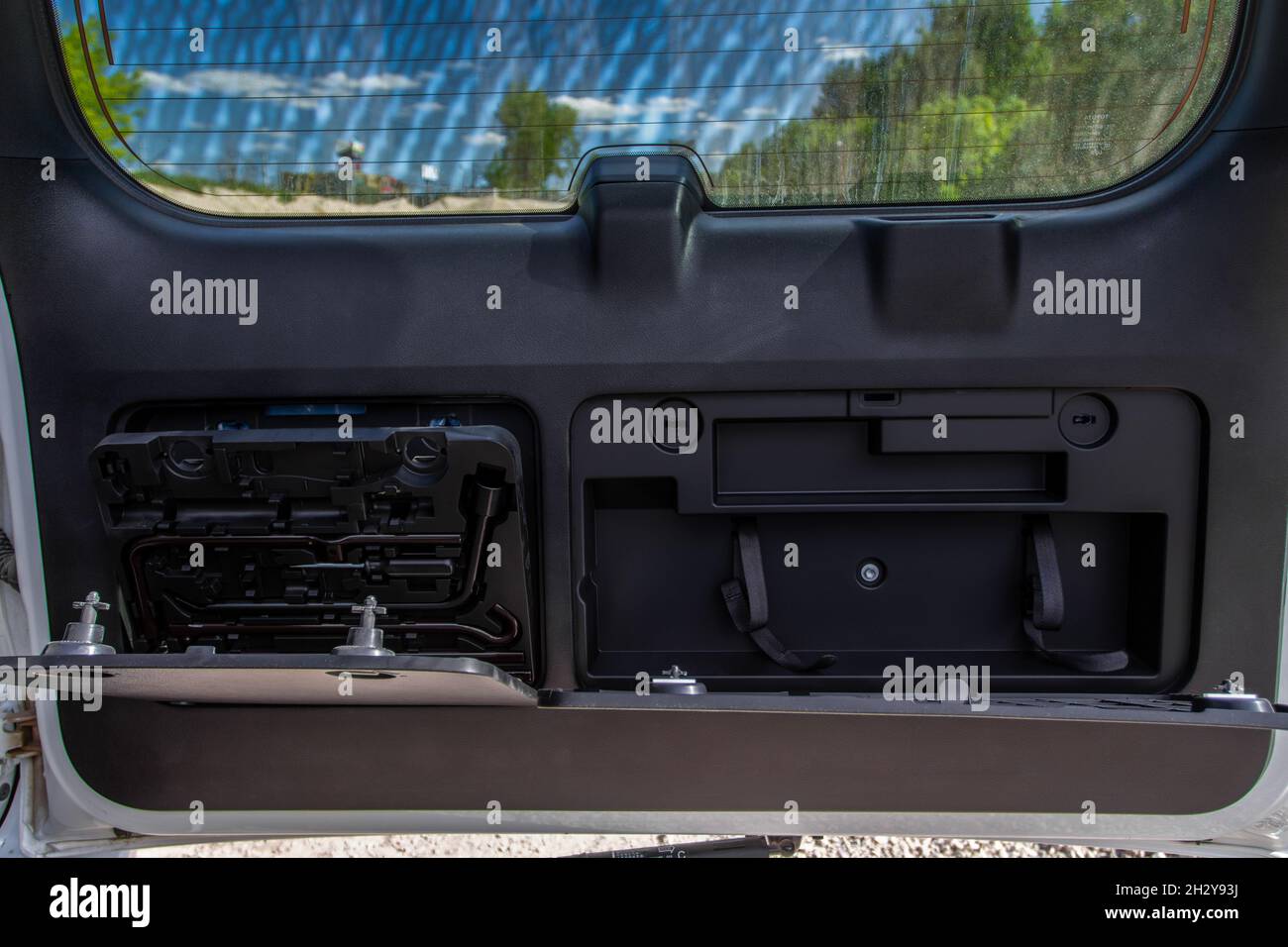 Car tools in opened trunk door Stock Photo Alamy