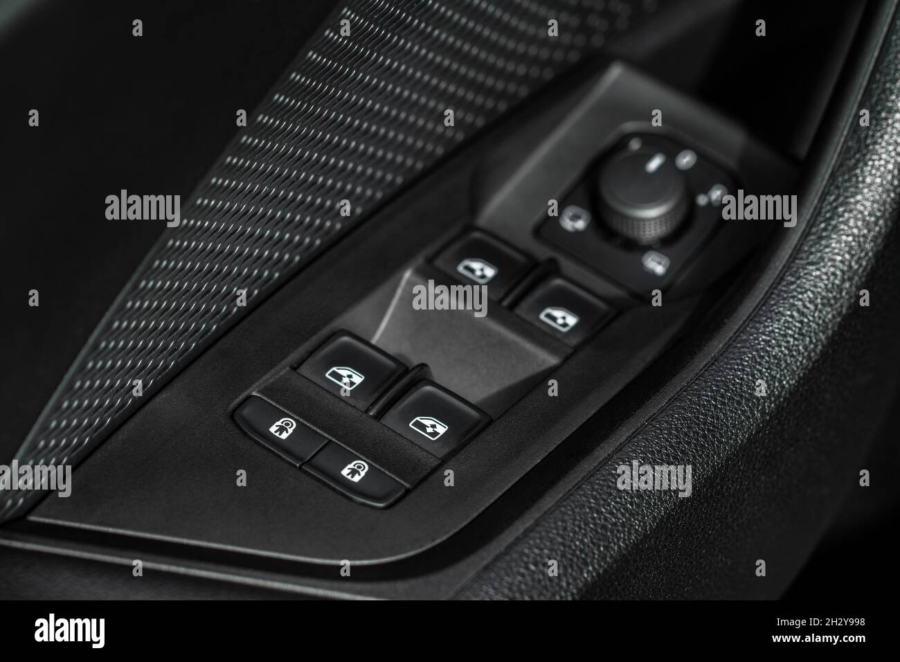 Close up view of button controlling window in modern car interior ...