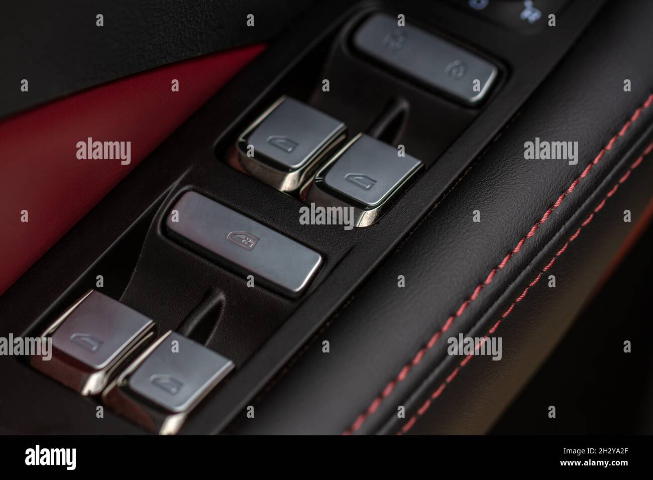 Close up view of button controlling window in modern car interior ...