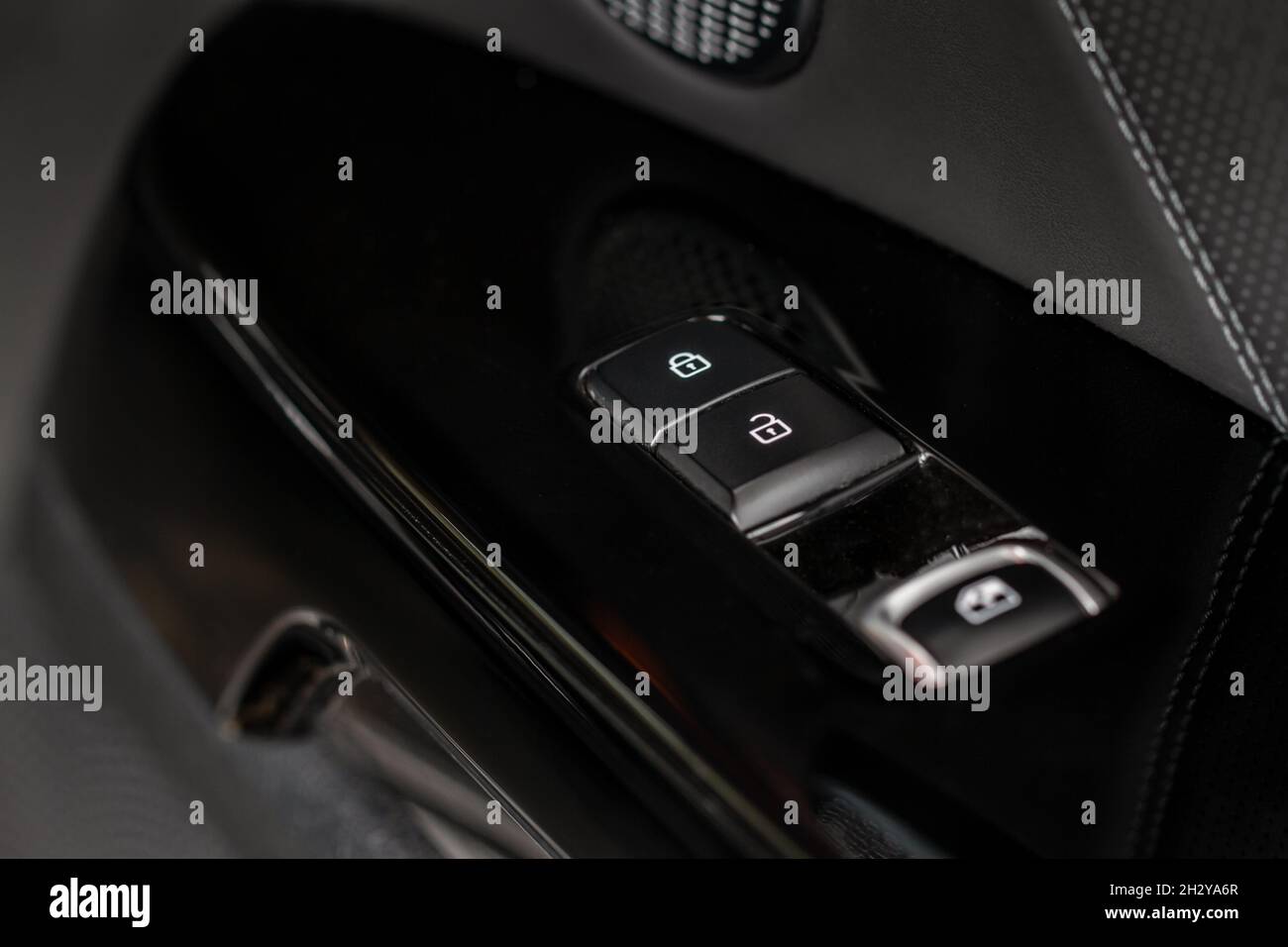 Car door lock switch close up. A car lock button. Car door handle with