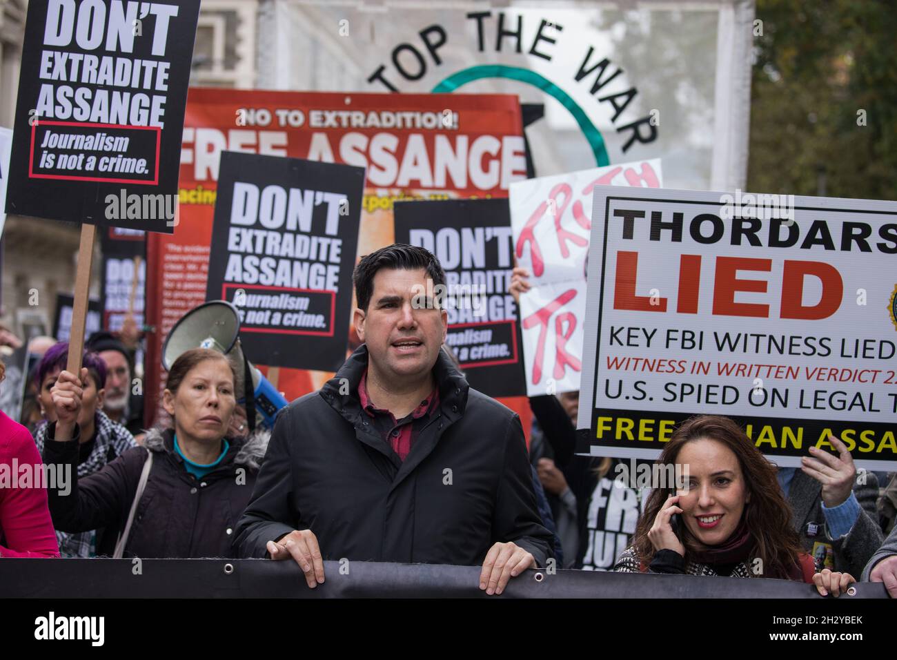 London, UK. 23rd October, 2021. Richard Burgon MP (c) and Stella Moris (r), fiancée of Wikileaks founder Julian Assange, take part in the March for Assange from BBC Broadcasting House to the Royal Courts of Justice organised by the Don't Extradite Assange campaign. The US government will begin a High Court appeal on 27th October against a decision earlier this year not to extradite Assange to face espionage charges in the United States. Assange has been held in Belmarsh Prison since 2019. Credit: Mark Kerrison/Alamy Live News Stock Photo