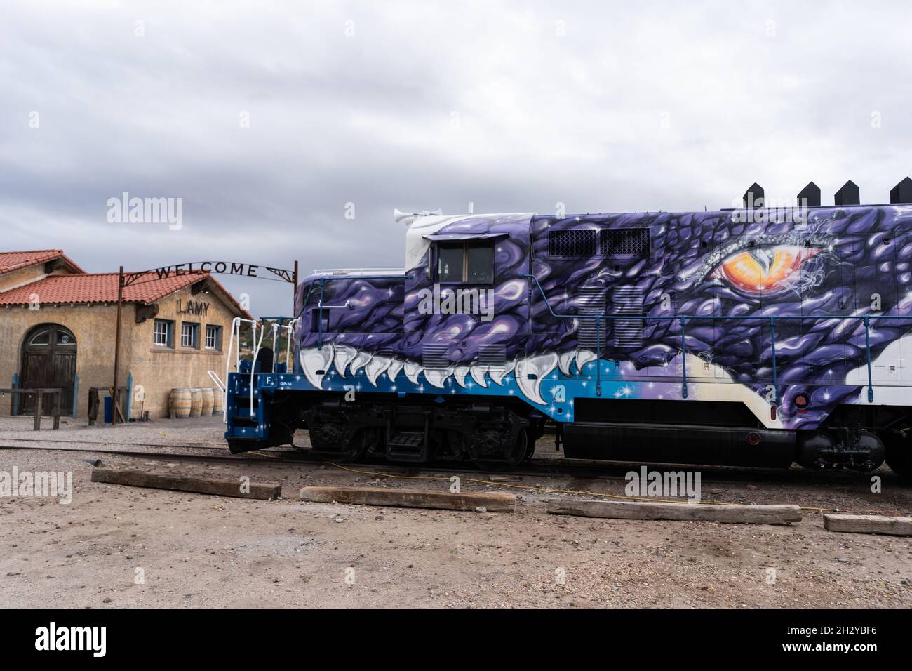 A locomotive painted top-to-bottom with “Game of Thrones” dragon art sits at the Lamy Amtrak station in Lamy, New Mexico, just south of Santa Fe. The Stock Photo