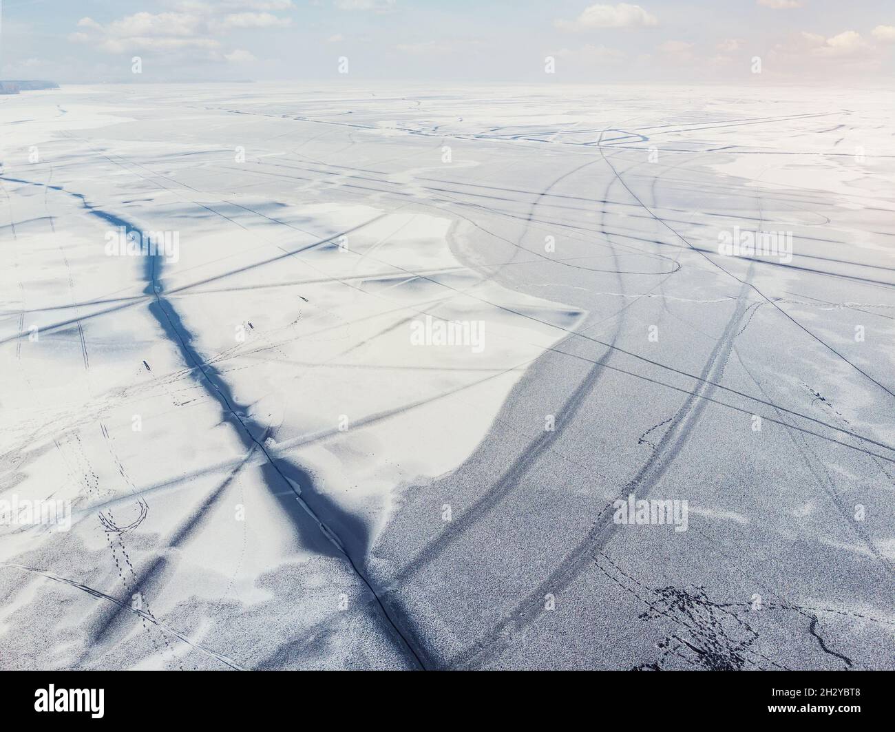 Flying above frozen lake cracked hi-res stock photography and images ...