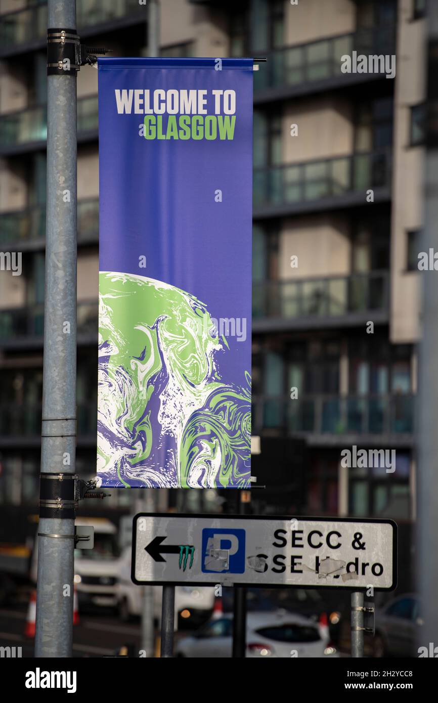 Glasgow, Scotland, UK. 24 October 2021 PICTURED: Branded COP26 banners are seen hanging from lamp posts along the COP26 zone. Views of the COP26 site showing the river Clyde and dockside, with the Scottish Event Campus buildings (OVO Hydro Arena, SEC Armadillo and SECC buildings) along with the Crown Plaza Hotel and the ring of steel security fence surrounding the area. Days until Heads of State, along with thousands of delegates and media and protestors are expected to land in Glasgow very shortly for the beginning of the Climate Change Summit starting on 31 October. Credit: Colin Fisher Stock Photo