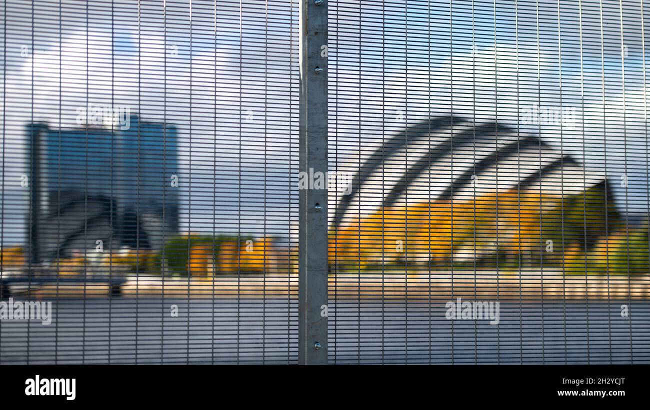 Glasgow, Scotland, UK. 24 October 2021 PICTURED: Glasgow Crown Plaza and SEC Armadillo building seen through the security perimeter fence. Views of the COP26 site showing the river Clyde and dockside, with the Scottish Event Campus buildings (OVO Hydro Arena, SEC Armadillo and SECC buildings) along with the Crown Plaza Hotel and the ring of steel security fence surrounding the area. Days until Heads of State, along with thousands of delegates and media and protestors are expected to land in Glasgow very shortly for the beginning of the Climate Change Summit starting on 31 October. Credit: Coli Stock Photo