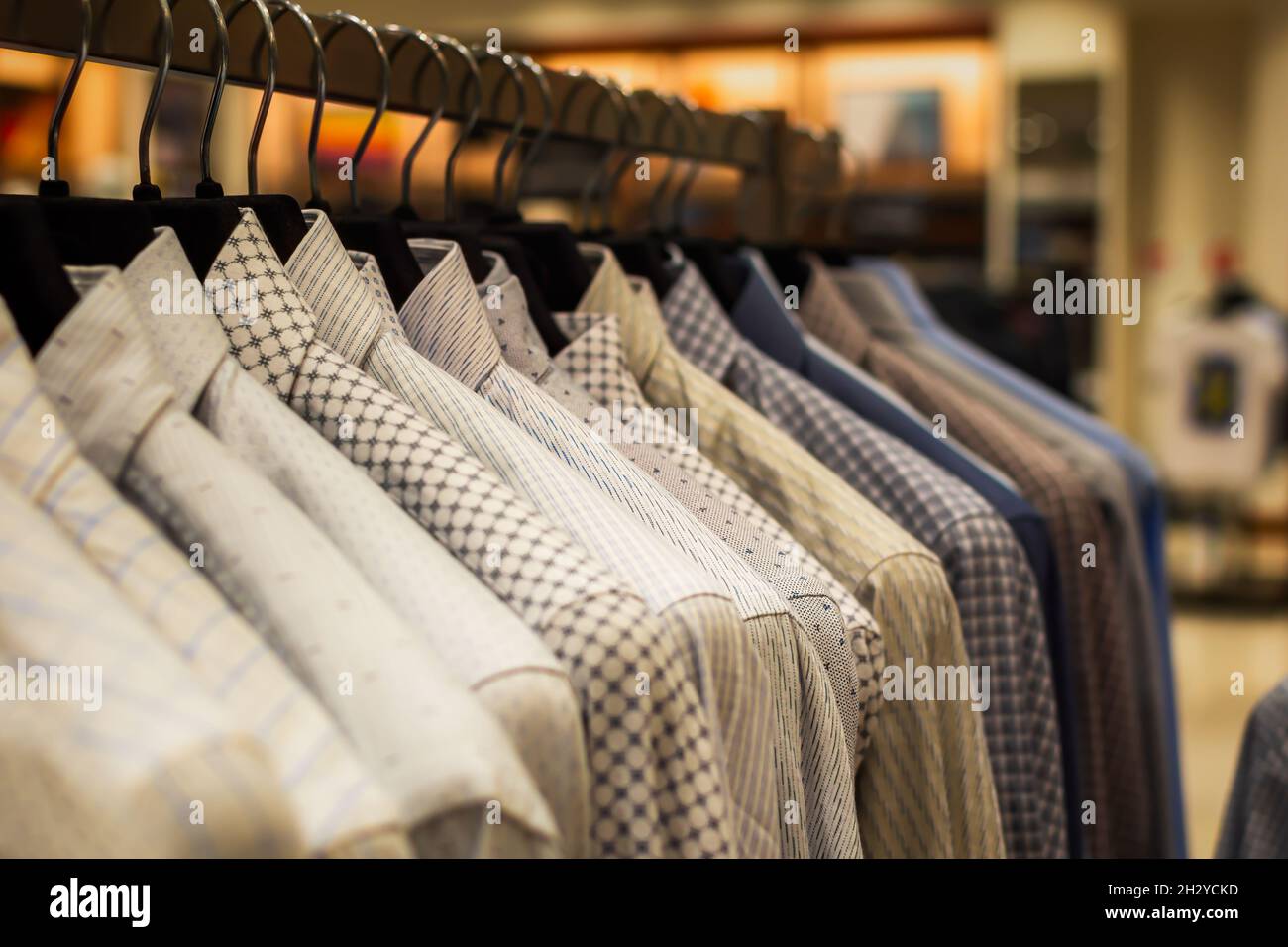 Premium Photo  Men's shirts on hangers in the store, close-up