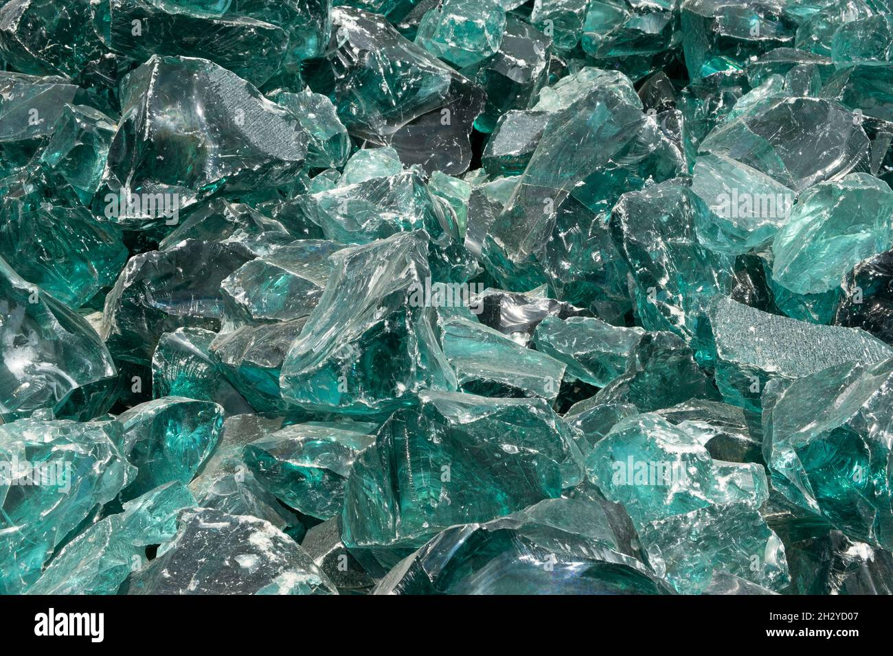 large Chunk of Aqua Glass Rock Slag for Garden decor. Glass in Nature Full frame texture top view Stock Photo